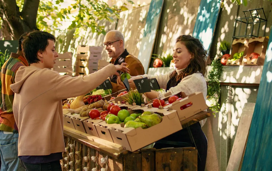 Outdoor market stall selling fresh fruits and vegetables